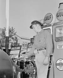 gas station attendant filling tank