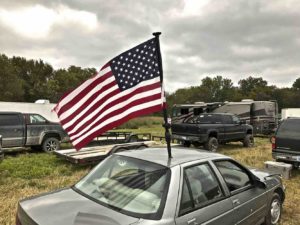 car-with-flag-pole-in-roof